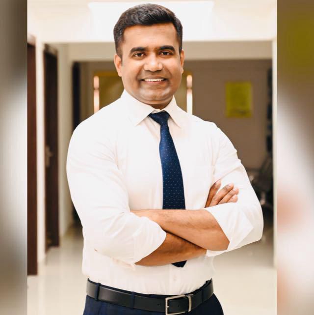 Dr. Harish Gowda at his office desk, HIMAS Hospital